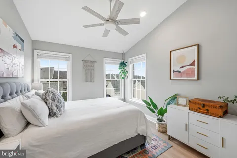 a bedroom with a large bed and a window