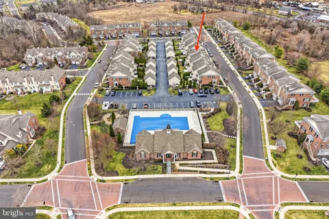 an aerial view of residential building and parking space