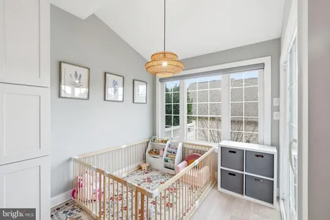 a bedroom with furniture and windows