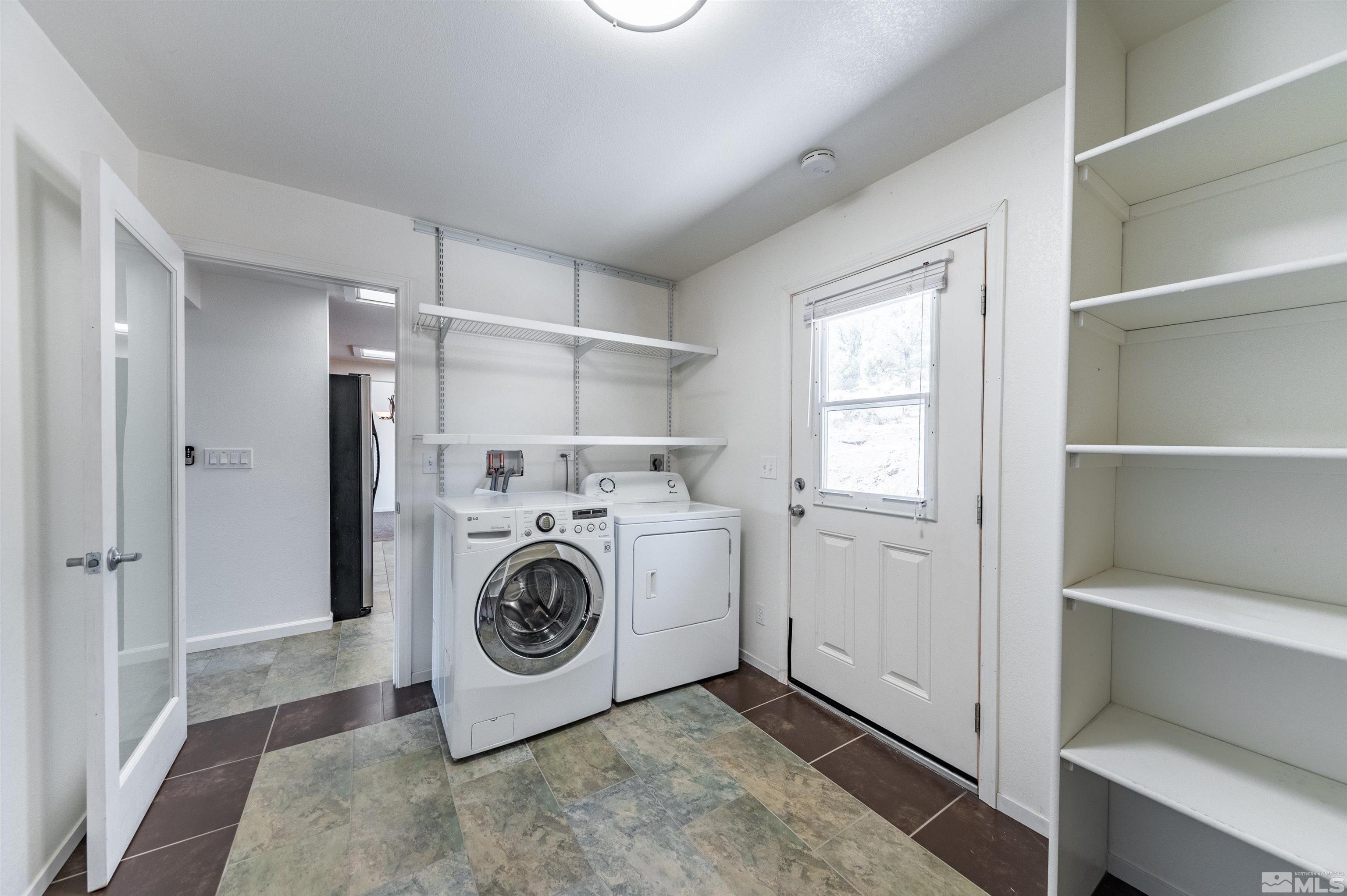 21940 Adobe Road Reno, NV 89521 - Photo 13 of 22 a utility room with dryer and washer