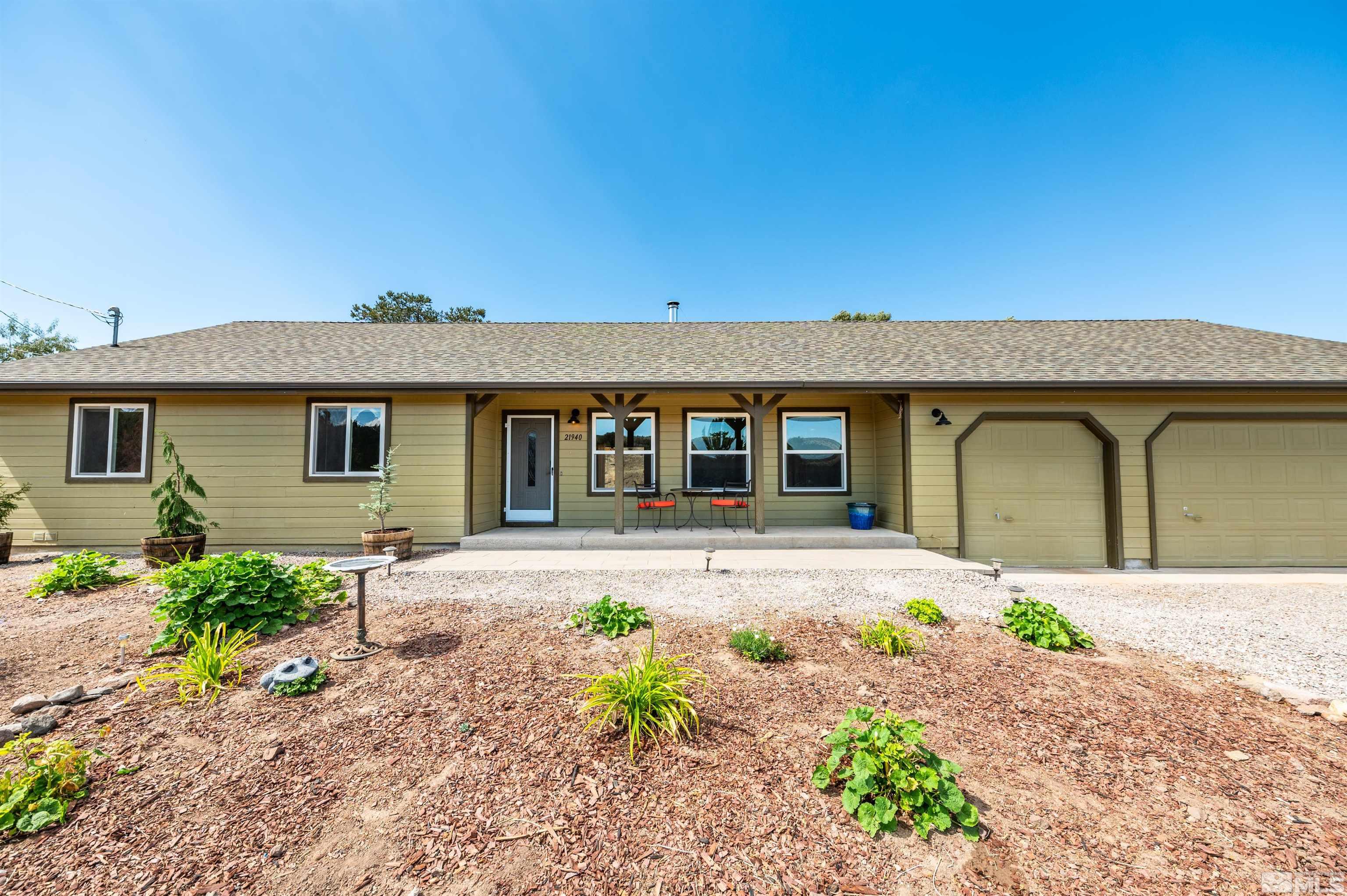 21940 Adobe Road Reno, NV 89521 - Photo 3 of 22 a front view of a house with garden