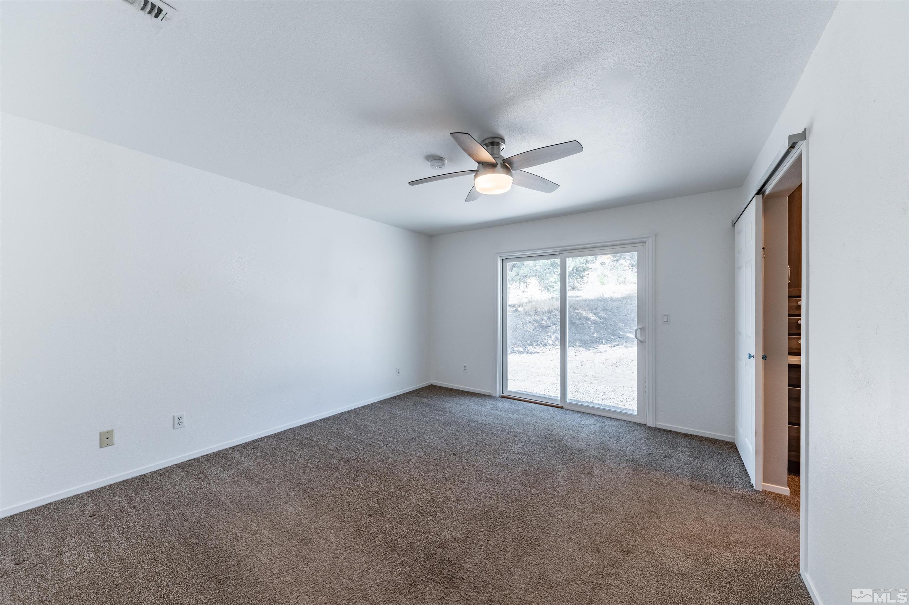 21940 Adobe Road Reno, NV 89521 - Photo 9 of 22 a view of an empty room with a window