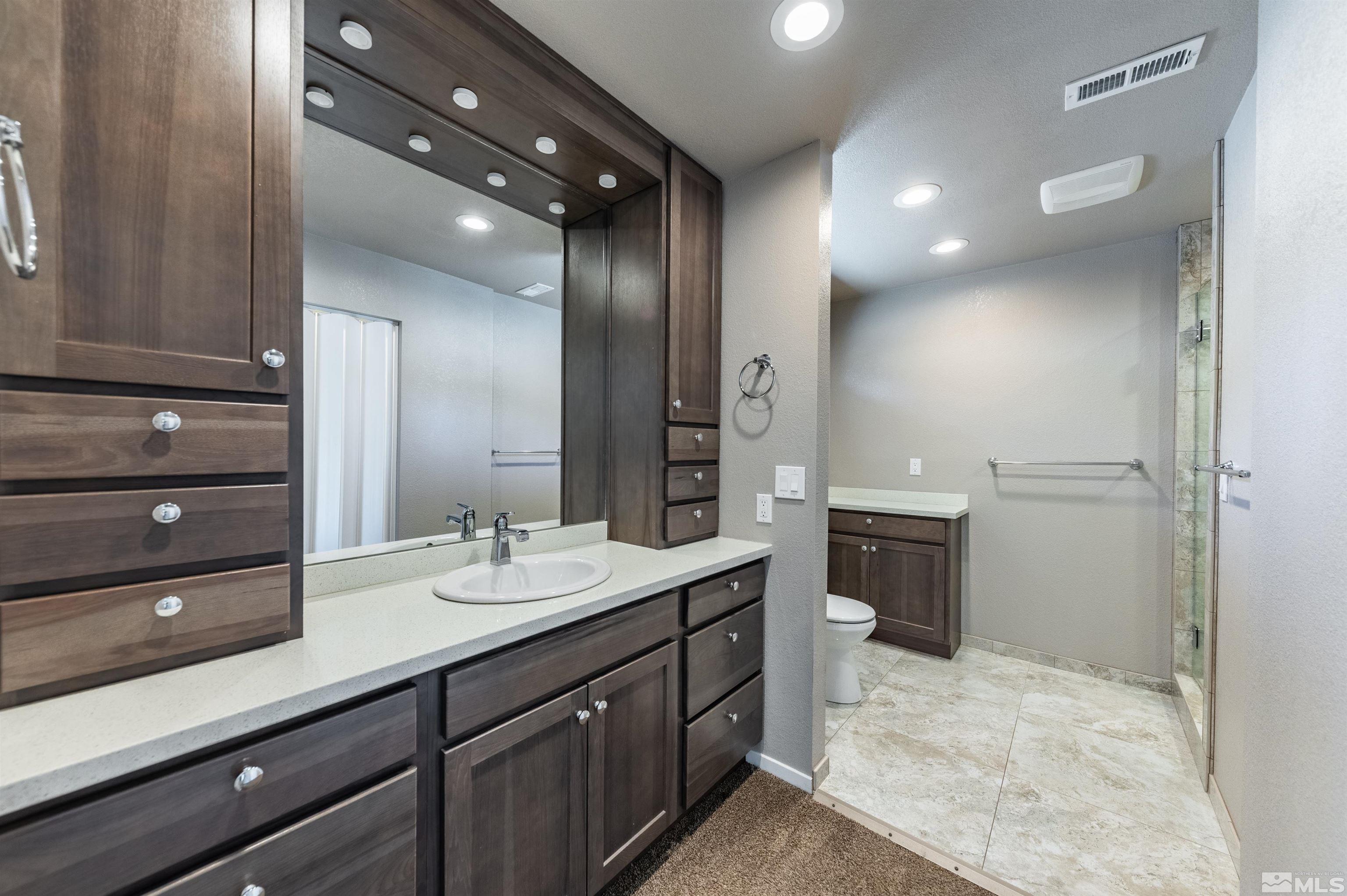 21940 Adobe Road Reno, NV 89521 - Photo 10 of 22 a bathroom with a sink double vanity and a mirror