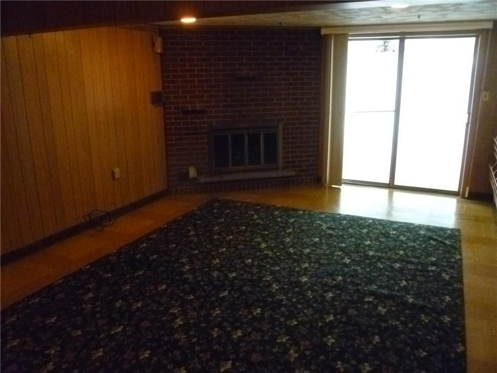 20 Swallow Hill Road Carnegie, PA 15106 - Photo 18 of 25 Lower level family room with fireplace. Sunroom is off of the family room.