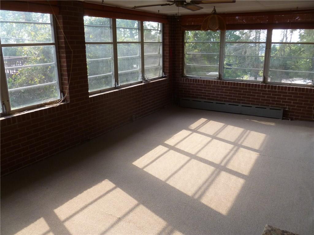 20 Swallow Hill Road Carnegie, PA 15106 - Photo 5 of 25 Four season room with new carpet off of the dining room on the main floor. More space to relax.