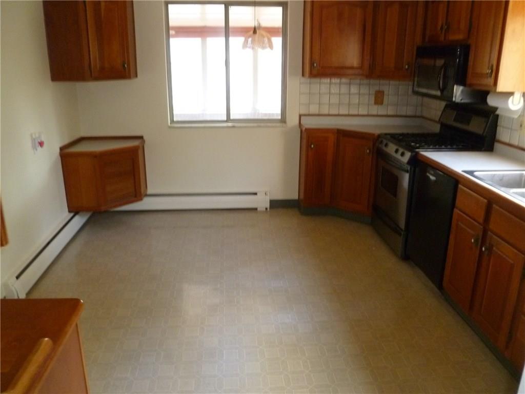 20 Swallow Hill Road Carnegie, PA 15106 - Photo 6 of 25 Eat-in kitchen with wood cabinets and newer appliances.