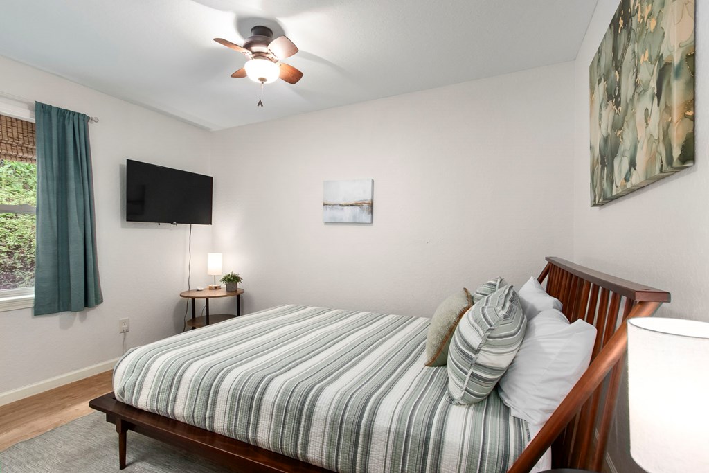 204 Hiawassee River Road Murphy, NC 28906 - Photo 12 of 79 a bedroom with a bed and a flat screen tv