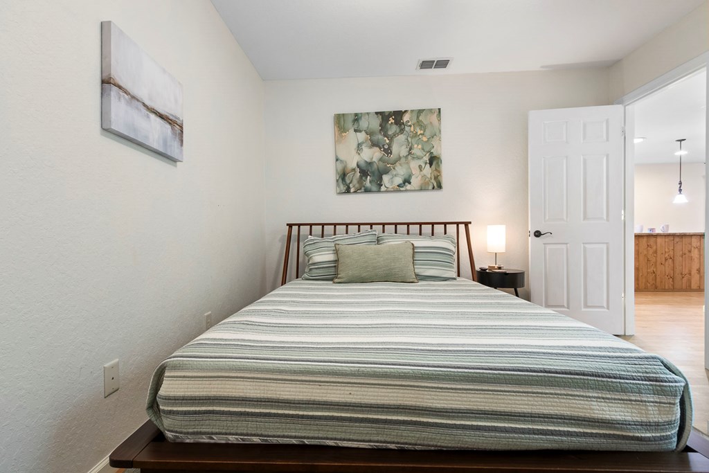 204 Hiawassee River Road Murphy, NC 28906 - Photo 14 of 79 a bedroom with a bed and painting on the wall