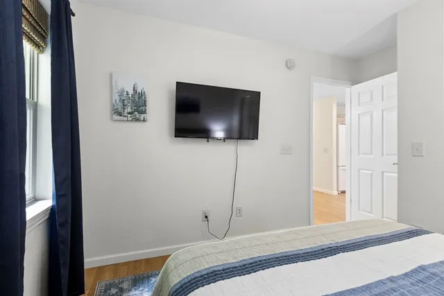 a view of balcony with wooden floor and outdoor seating