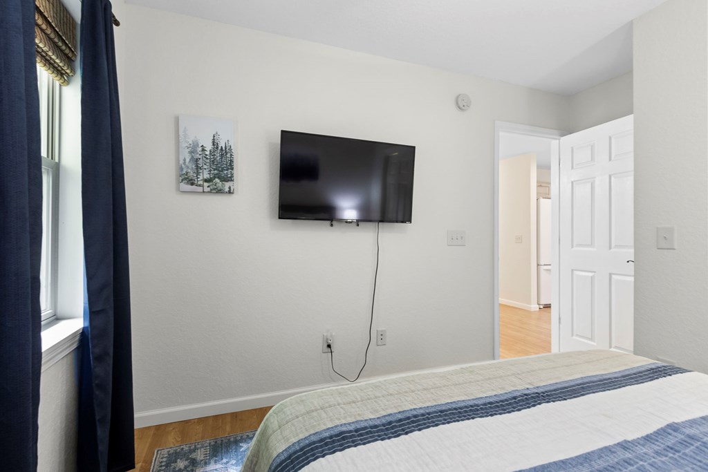 204 Hiawassee River Road Murphy, NC 28906 - Photo 18 of 79 a bedroom with a bed and a flat screen tv