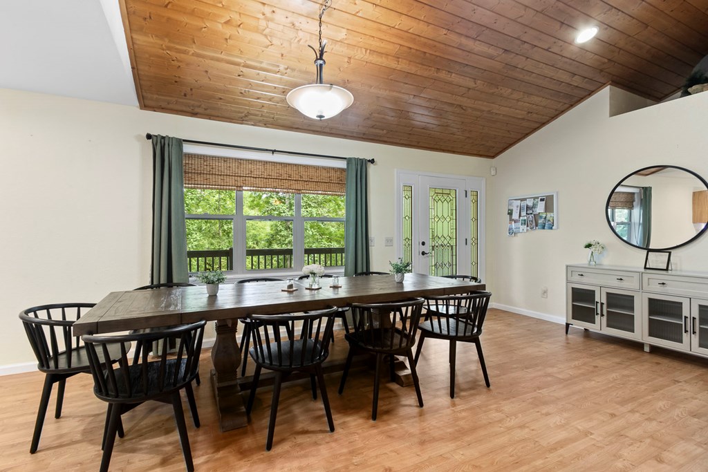 204 Hiawassee River Road Murphy, NC 28906 - Photo 22 of 79 a view of a dining room with furniture window and wooden floor