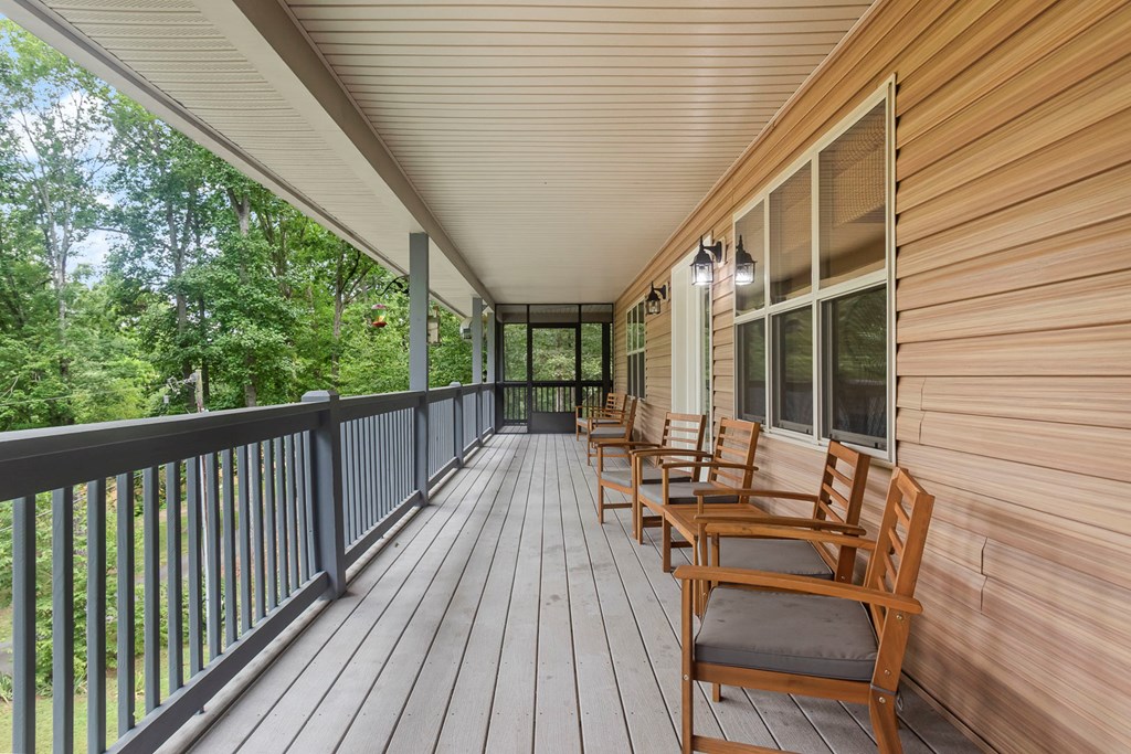 204 Hiawassee River Road Murphy, NC 28906 - Photo 34 of 79 a view of balcony with chairs and wooden fence