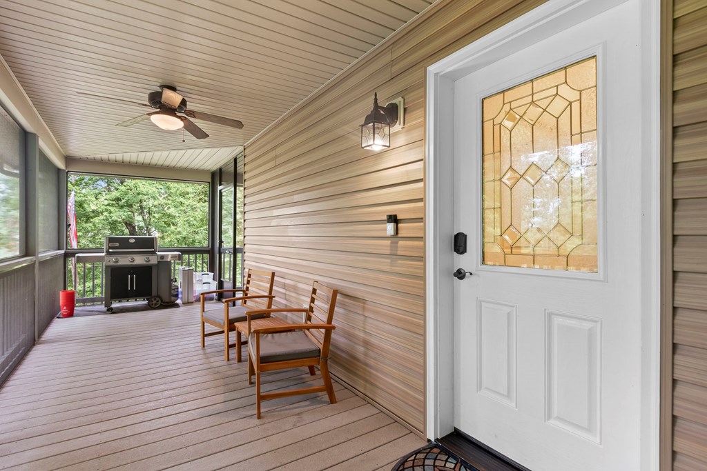 204 Hiawassee River Road Murphy, NC 28906 - Photo 4 of 79 a dining room with wooden floor a chandelier a glass table and chairs