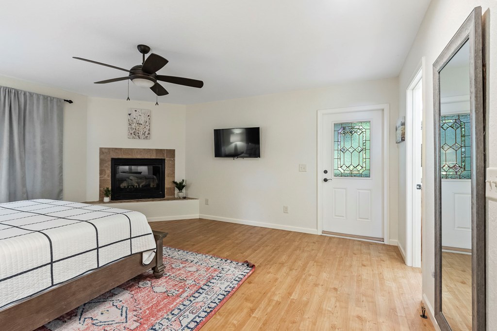 204 Hiawassee River Road Murphy, NC 28906 - Photo 44 of 79 a bedroom with a bed and a fireplace