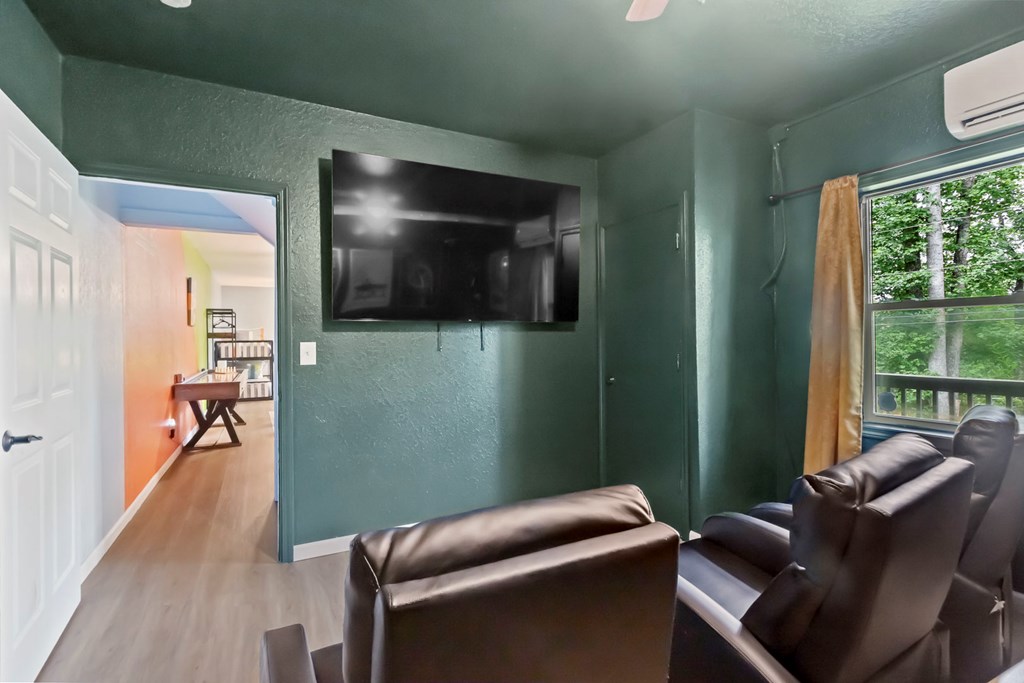 204 Hiawassee River Road Murphy, NC 28906 - Photo 63 of 79 a living room with furniture and a flat screen tv