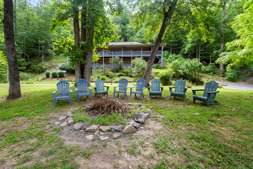 204 Hiawassee River Road Murphy, NC 28906 - Photo 68 of 79 a view of a chair and table in backyard of the house