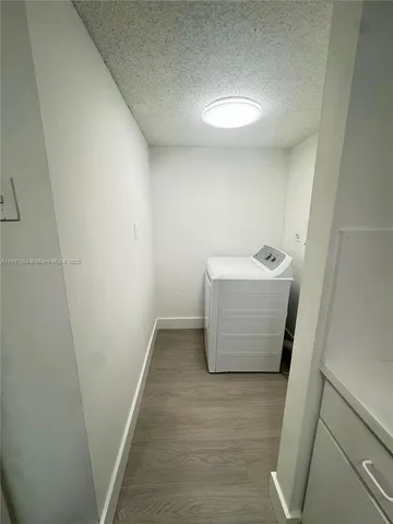 a kitchen with a sink a stove a refrigerator and cabinets