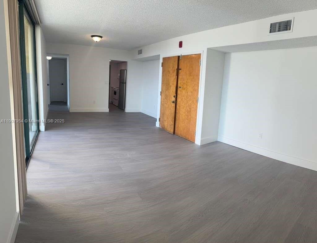 11780 Southwest 18th Street, Unit 5282 Miami, FL 33175 - Photo 15 of 19 a view of a hallway with an empty room