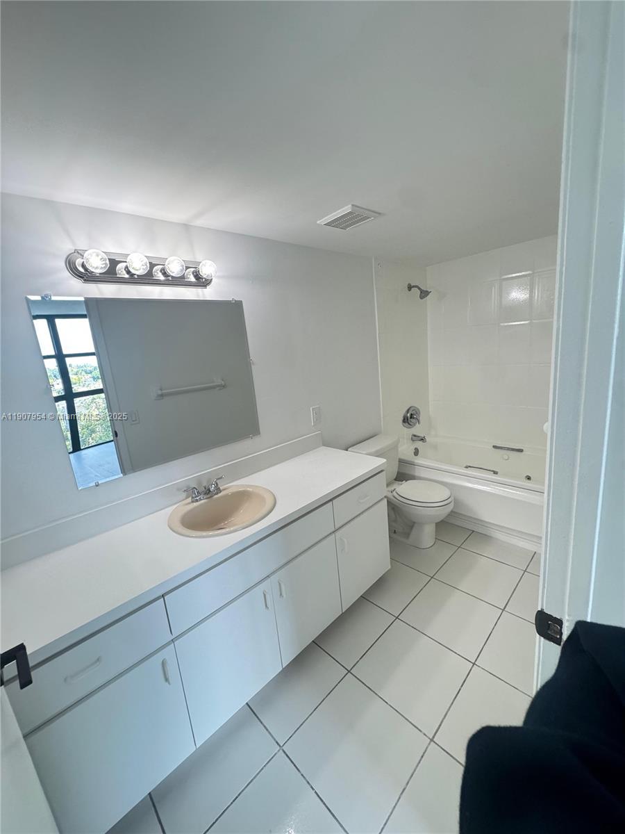 11780 Southwest 18th Street, Unit 5282 Miami, FL 33175 - Photo 17 of 19 a bathroom with a sink and a mirror