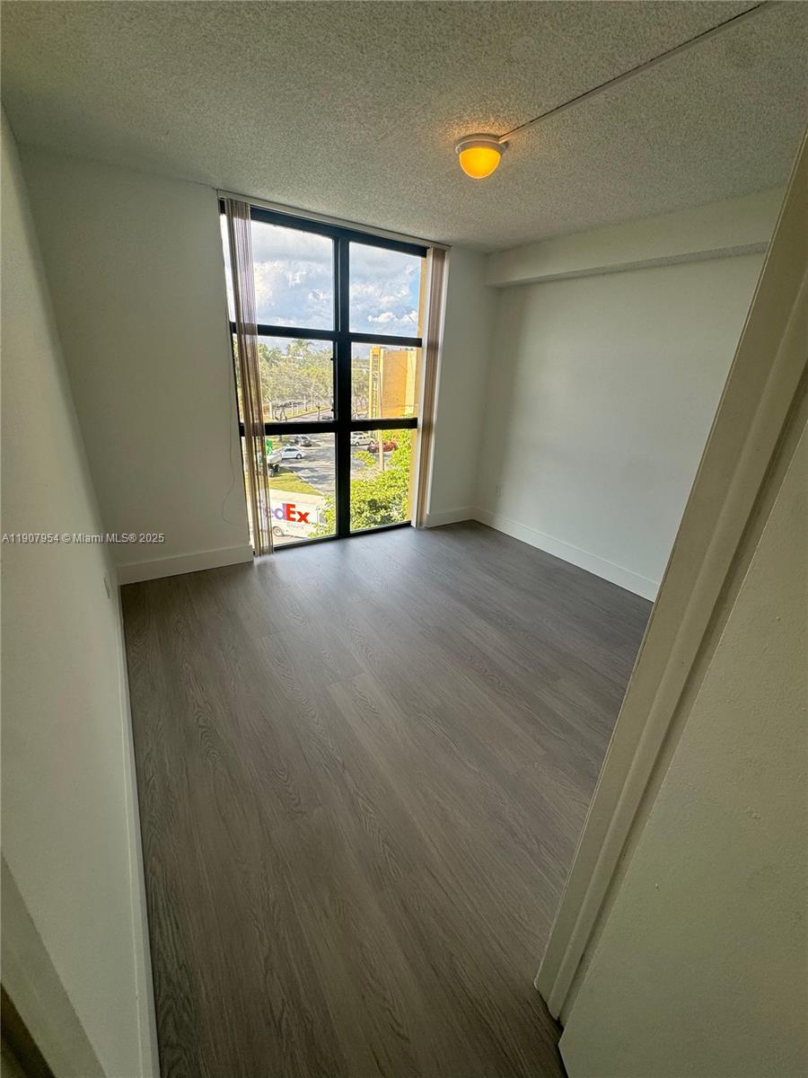 11780 Southwest 18th Street, Unit 5282 Miami, FL 33175 - Photo 4 of 19 an empty room with windows and closet