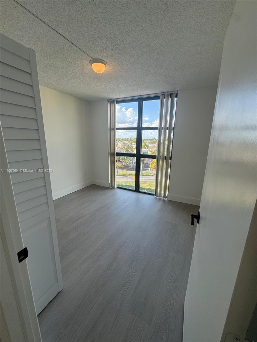 11780 Southwest 18th Street, Unit 5282 Miami, FL 33175 - Photo 9 of 19 an empty room with windows and closet