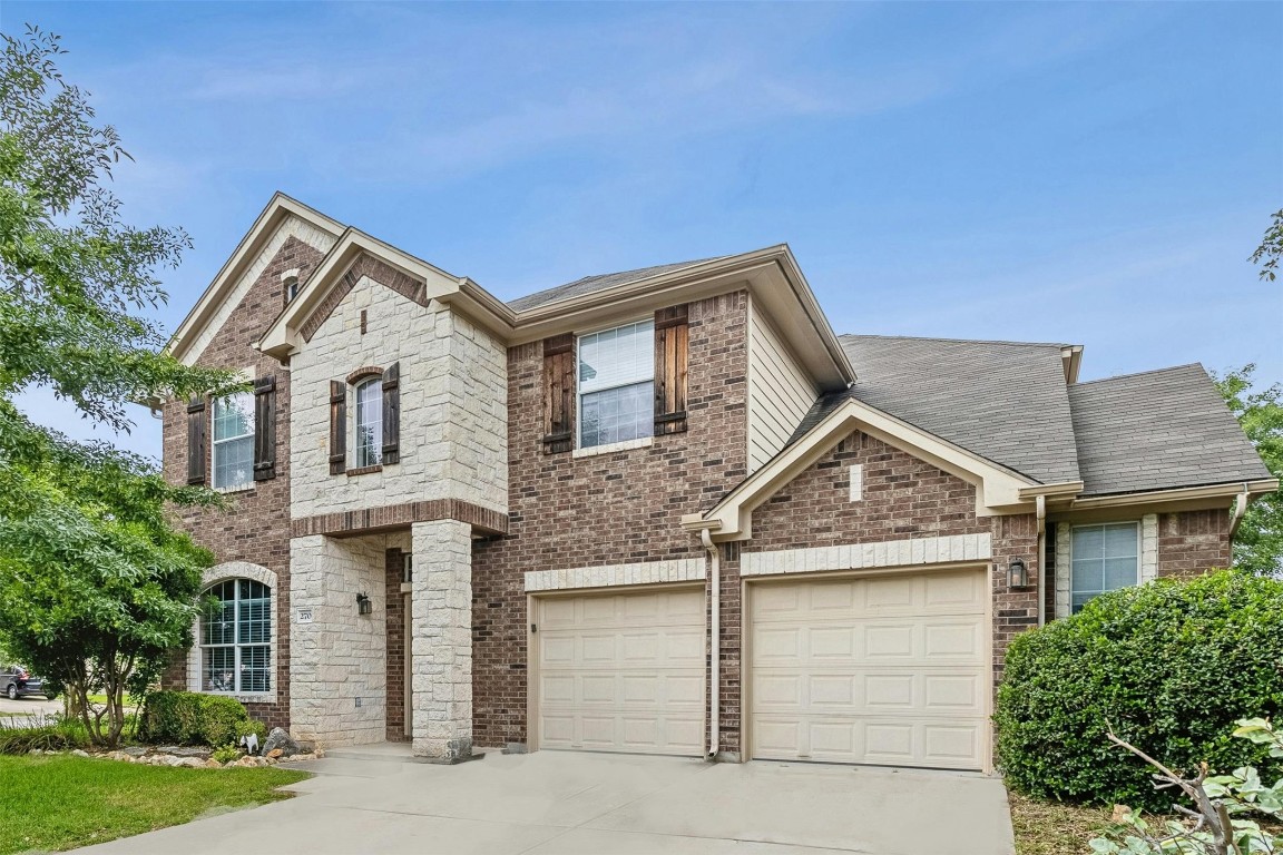 a front view of a house with yard