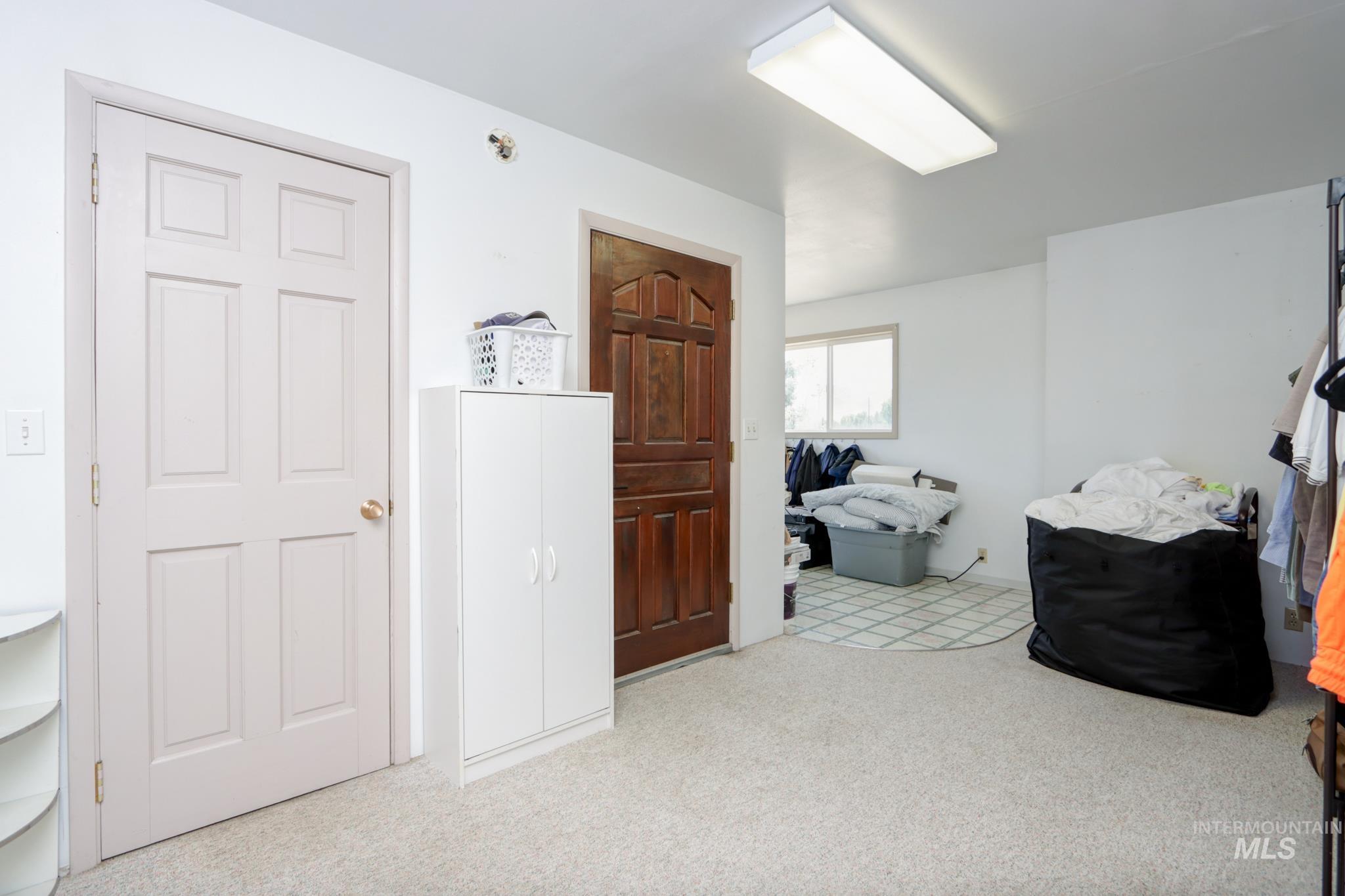 2528 Waterwheel Road Emmett, ID 83617 - Photo 36 of 50 White cabinetry with gold-tone hardware, wood-finish flooring, and light-toned walls