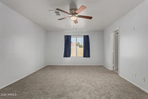 a bathroom with a sink toilet vanity and shower