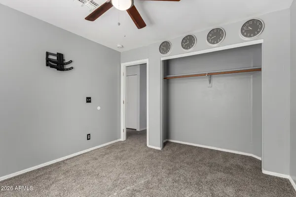 a building outdoor space with patio furniture and a potted plant