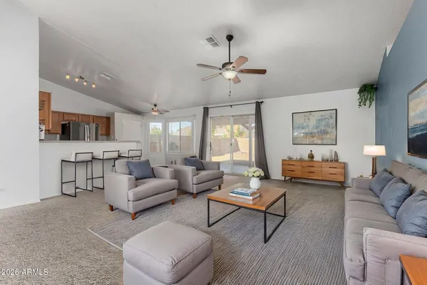 a living room with furniture and a large window