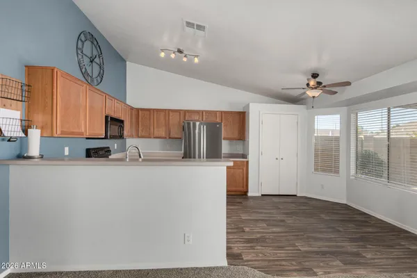 a kitchen with a sink a counter space and a stove