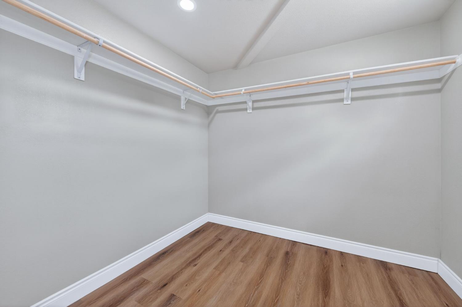 16564 Monreal Road Madera, CA 93636 - Photo 49 of 59 a view of an empty walk in closet