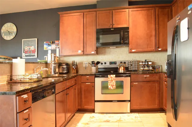 a large kitchen with a table and chairs