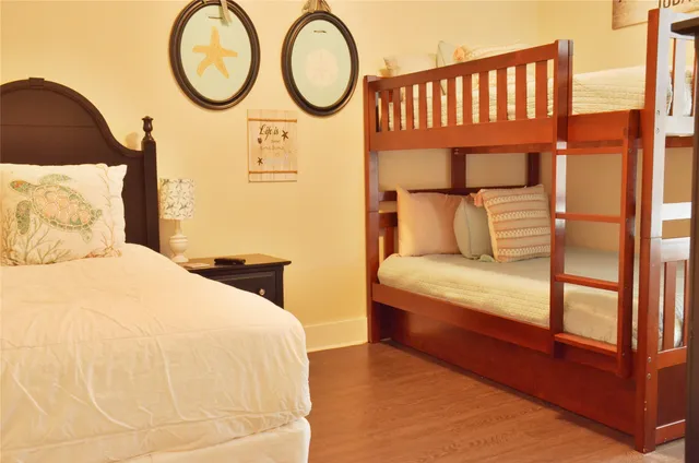 a bedroom with a bed and a night stand