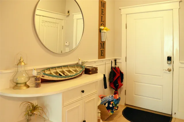 a living room with furniture ceiling fan and a window