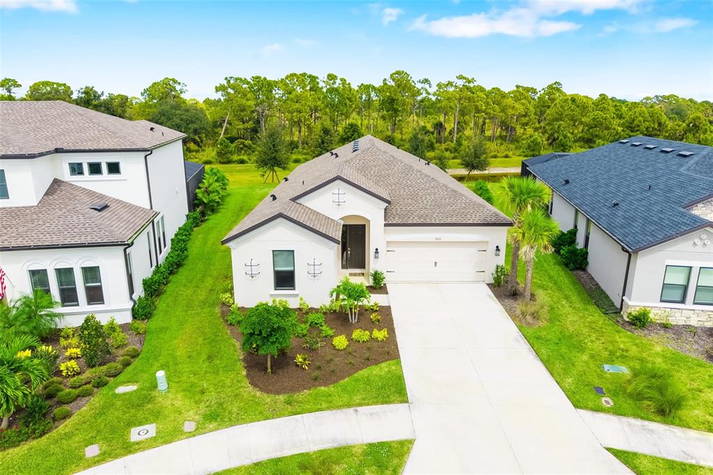 5604 Blue Reef Place Nokomis, FL 34275 - Photo 1 of 45 a view of house with garden