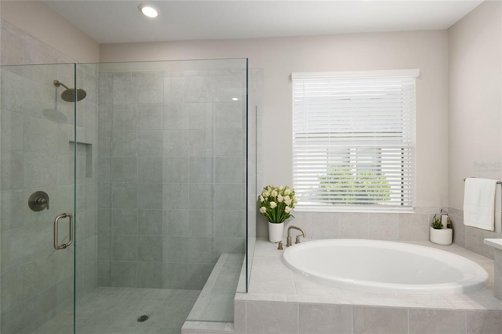 5604 Blue Reef Place Nokomis, FL 34275 - Photo 17 of 45 a white bath tub sitting next to a window