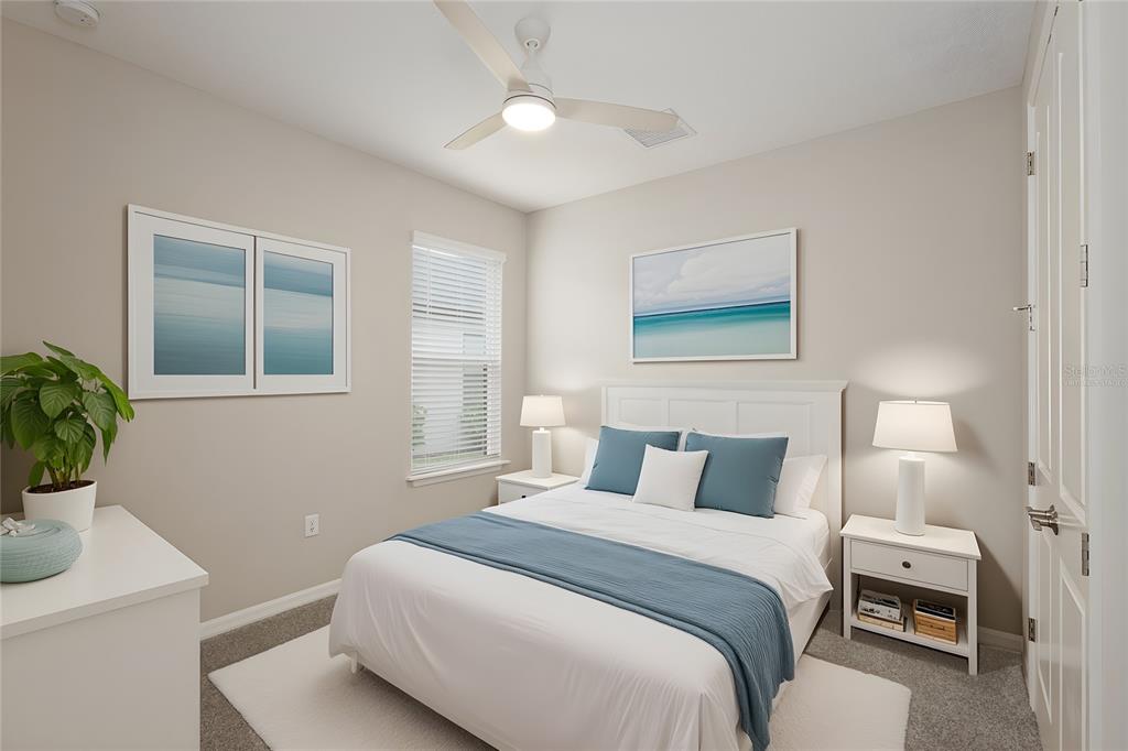 5604 Blue Reef Place Nokomis, FL 34275 - Photo 28 of 45 a bedroom with a bed and a potted plant