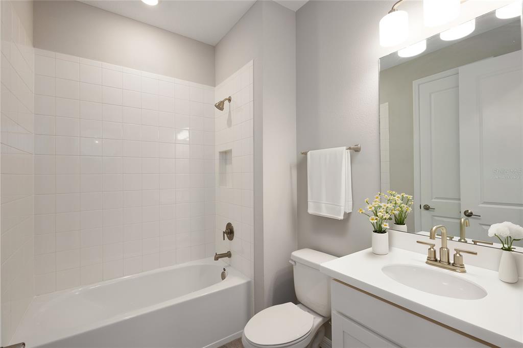 5604 Blue Reef Place Nokomis, FL 34275 - Photo 30 of 45 a bathroom with a sink toilet and shower