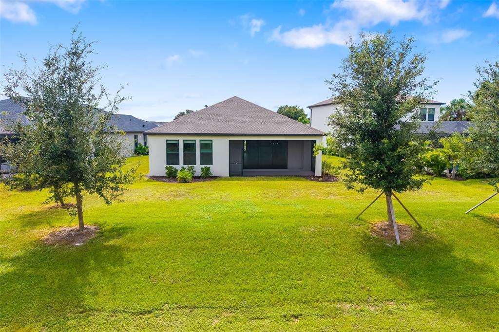 5604 Blue Reef Place Nokomis, FL 34275 - Photo 33 of 45 a view of a house with a yard
