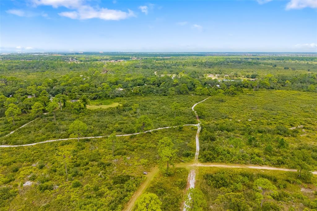 5604 Blue Reef Place Nokomis, FL 34275 - Photo 36 of 45 a view of an ocean and a yard
