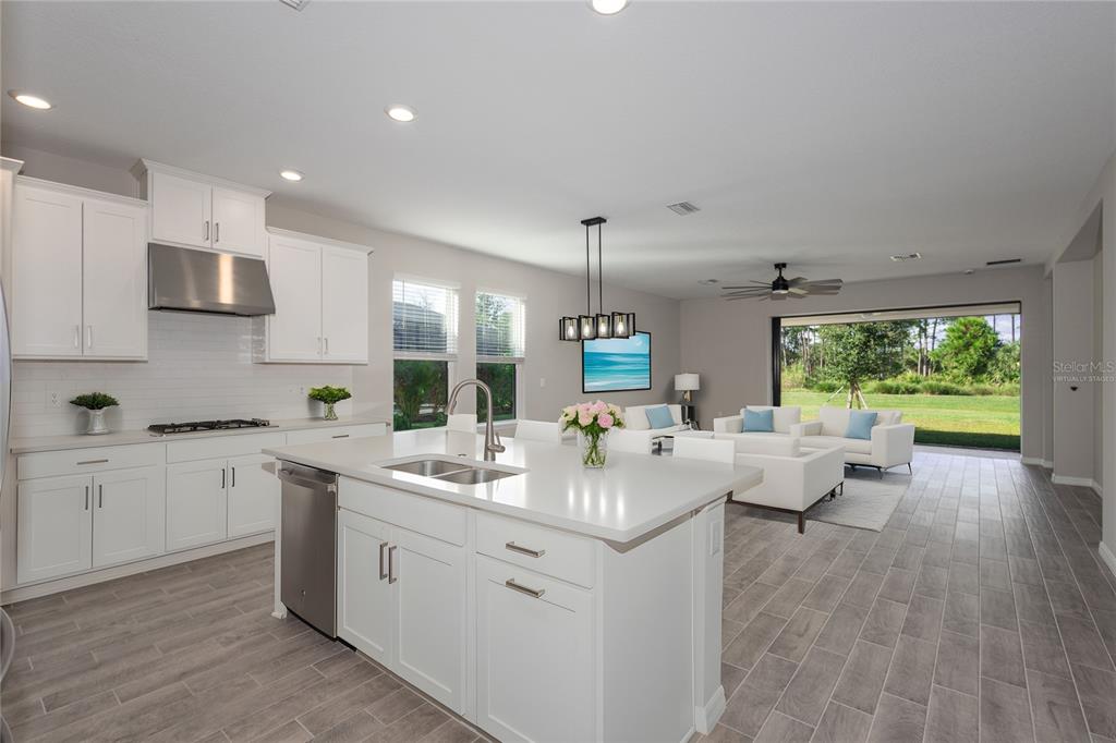 5604 Blue Reef Place Nokomis, FL 34275 - Photo 5 of 45 a large white kitchen with a large window