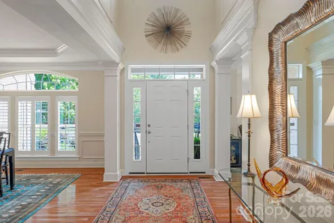 a view of room with window and hardwood floor