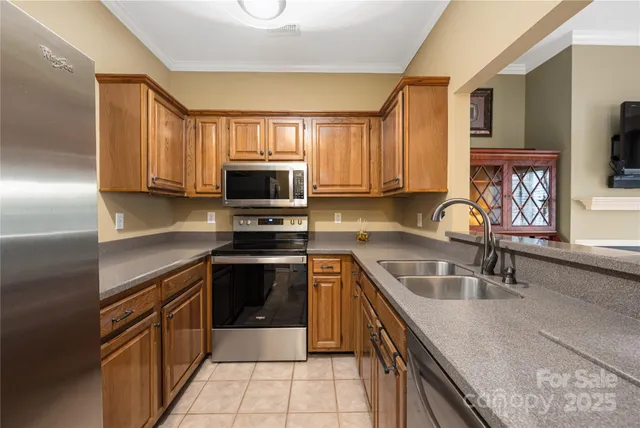 a kitchen with a sink stove top oven and microwave