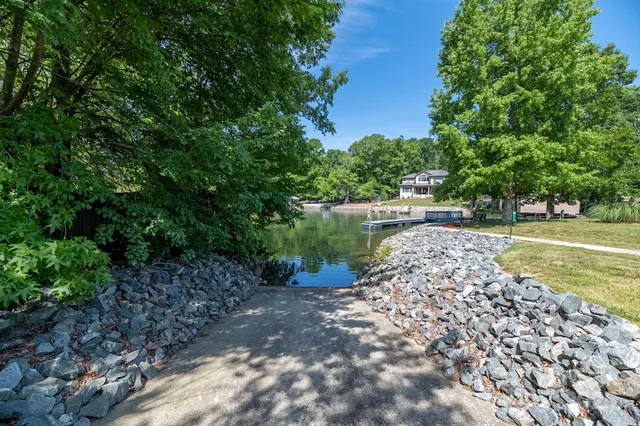 a view of a swimming pool with a lake view