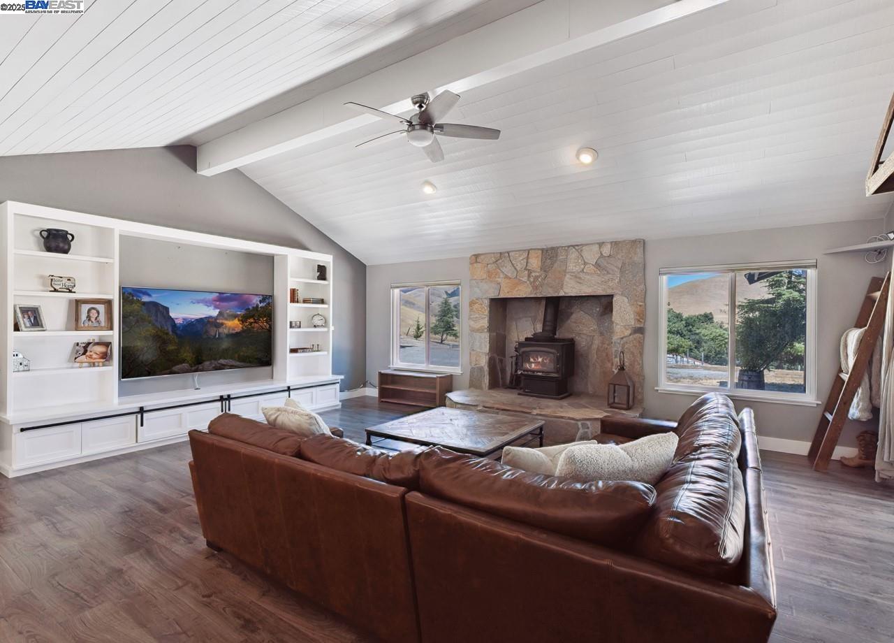 8191 Highland Road Livermore, CA 94551 - Photo 17 of 59 a living room with furniture and a flat screen tv