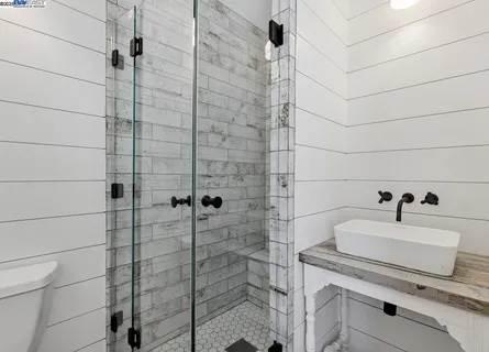 a bathroom with a bathtub and a shower