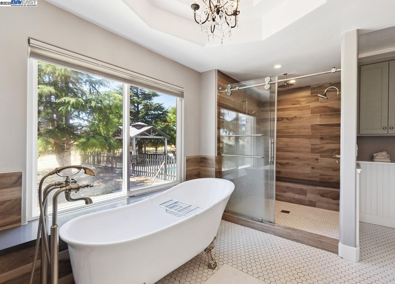 8191 Highland Road Livermore, CA 94551 - Photo 27 of 59 a bathroom with a bathtub and a shower