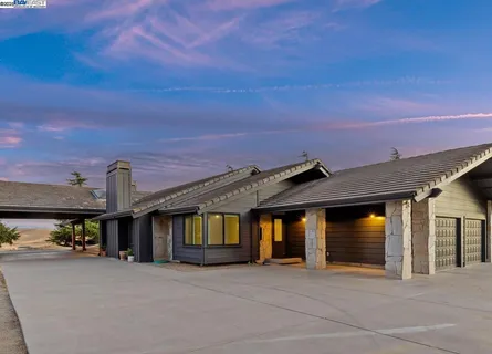 a view of swimming pool with outdoor seating