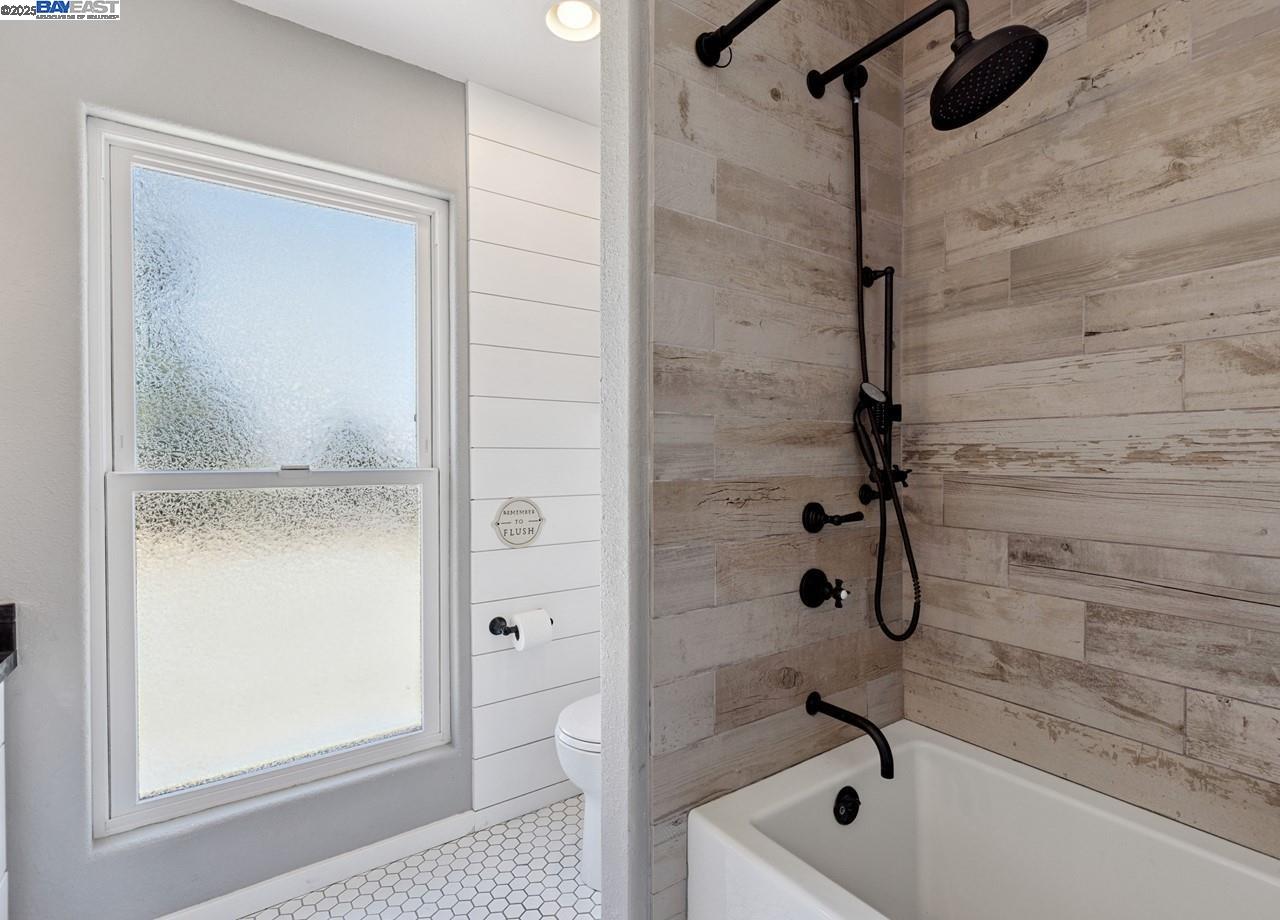 8191 Highland Road Livermore, CA 94551 - Photo 31 of 59 a bathroom with a tub and a shower